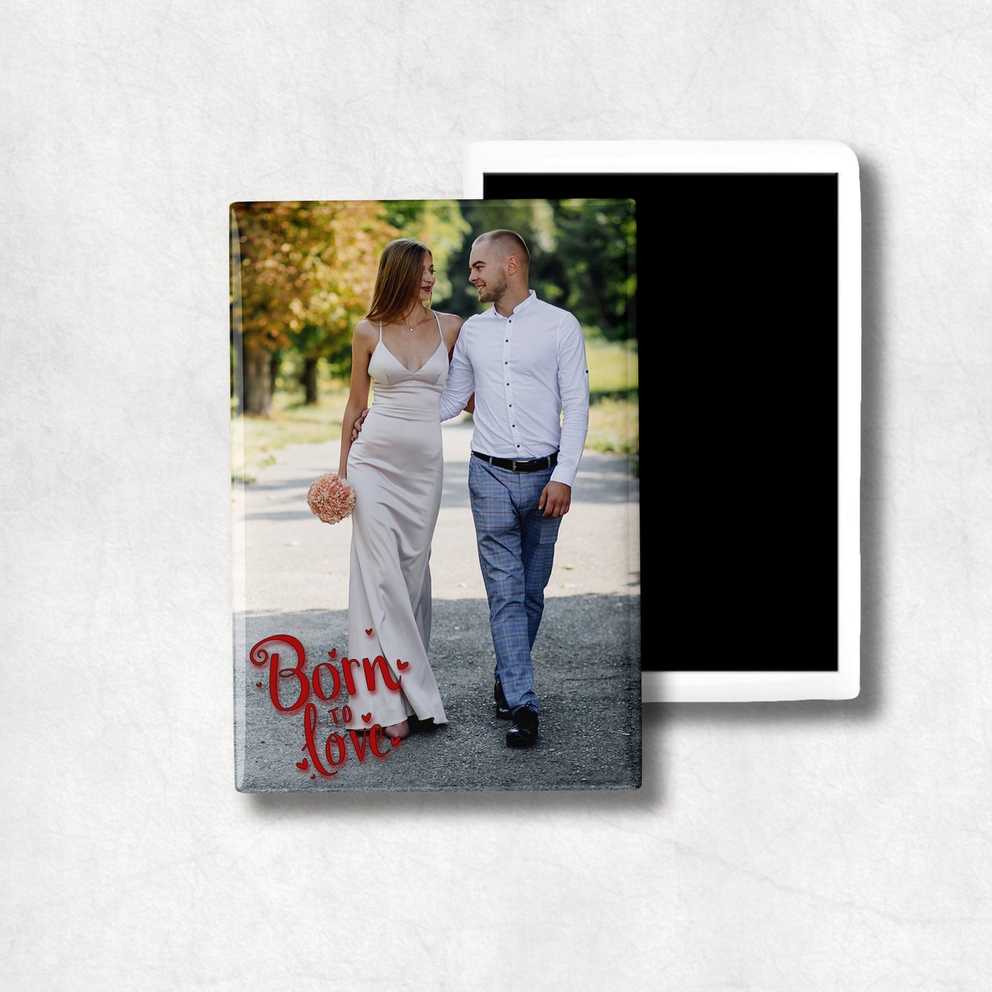 A vertical ceramic magnet with personalised photo and 'Born to Love' text.