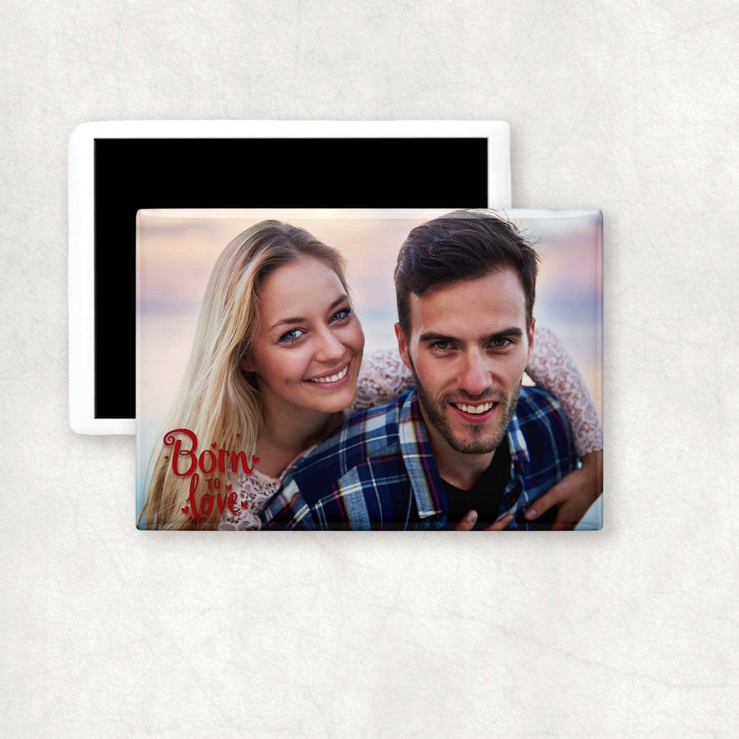 A horizontal ceramic magnet with personalised photo and 'Born to love' text.