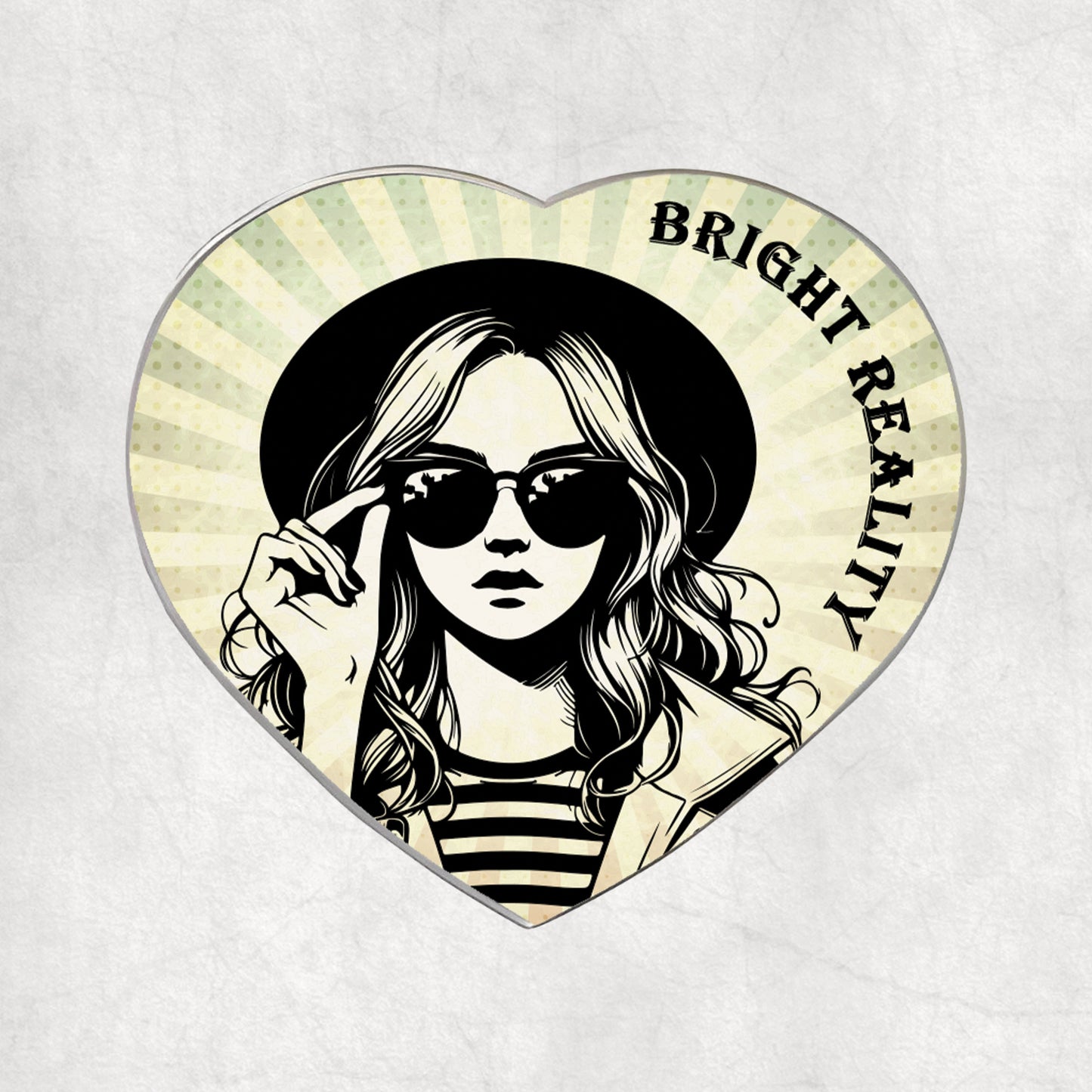 Heart-shaped metal magnet with a stylised illustration of a woman wearing sunglasses and text 'Bright Reality' on a light vintage background.