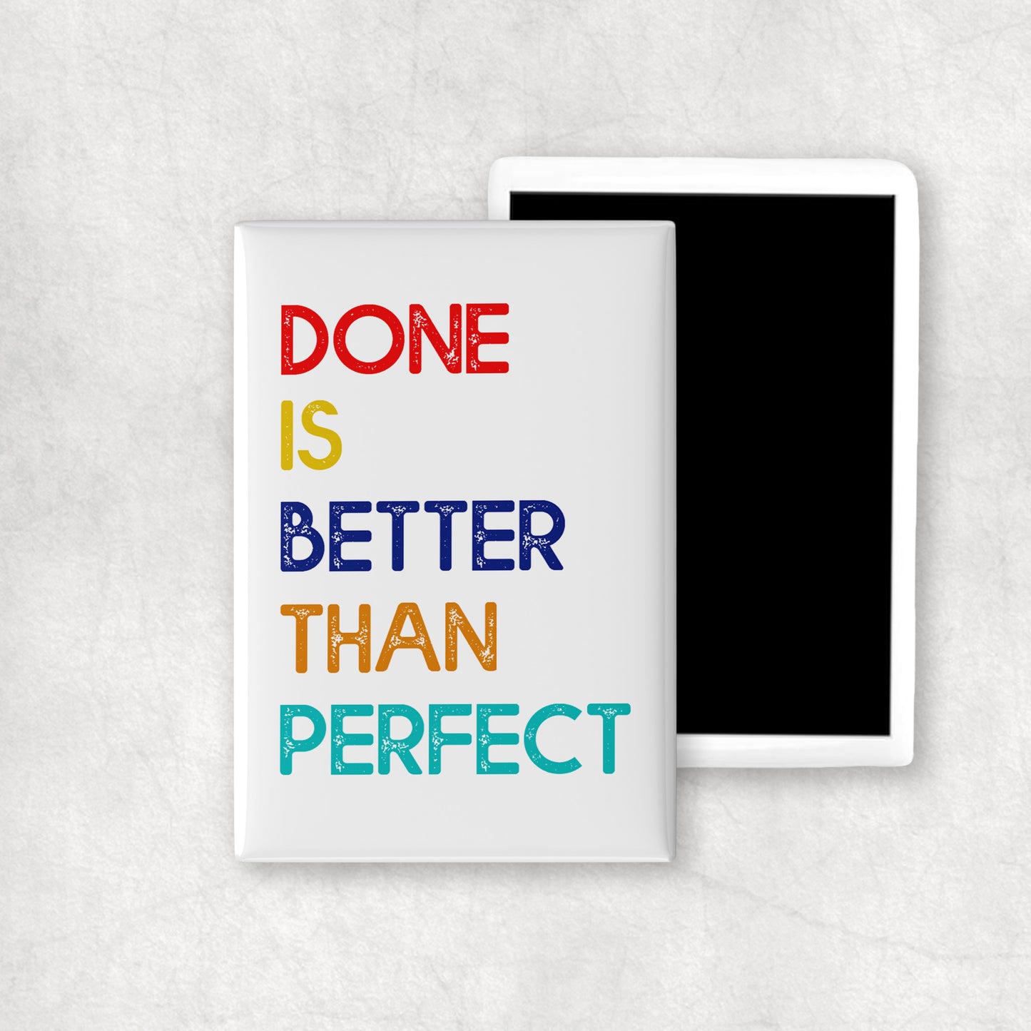 A vertical ceramic magnet with 'DONE IS BETTER THAN PERFECT' colourful text on a white background, a perfect gift for any occasion.