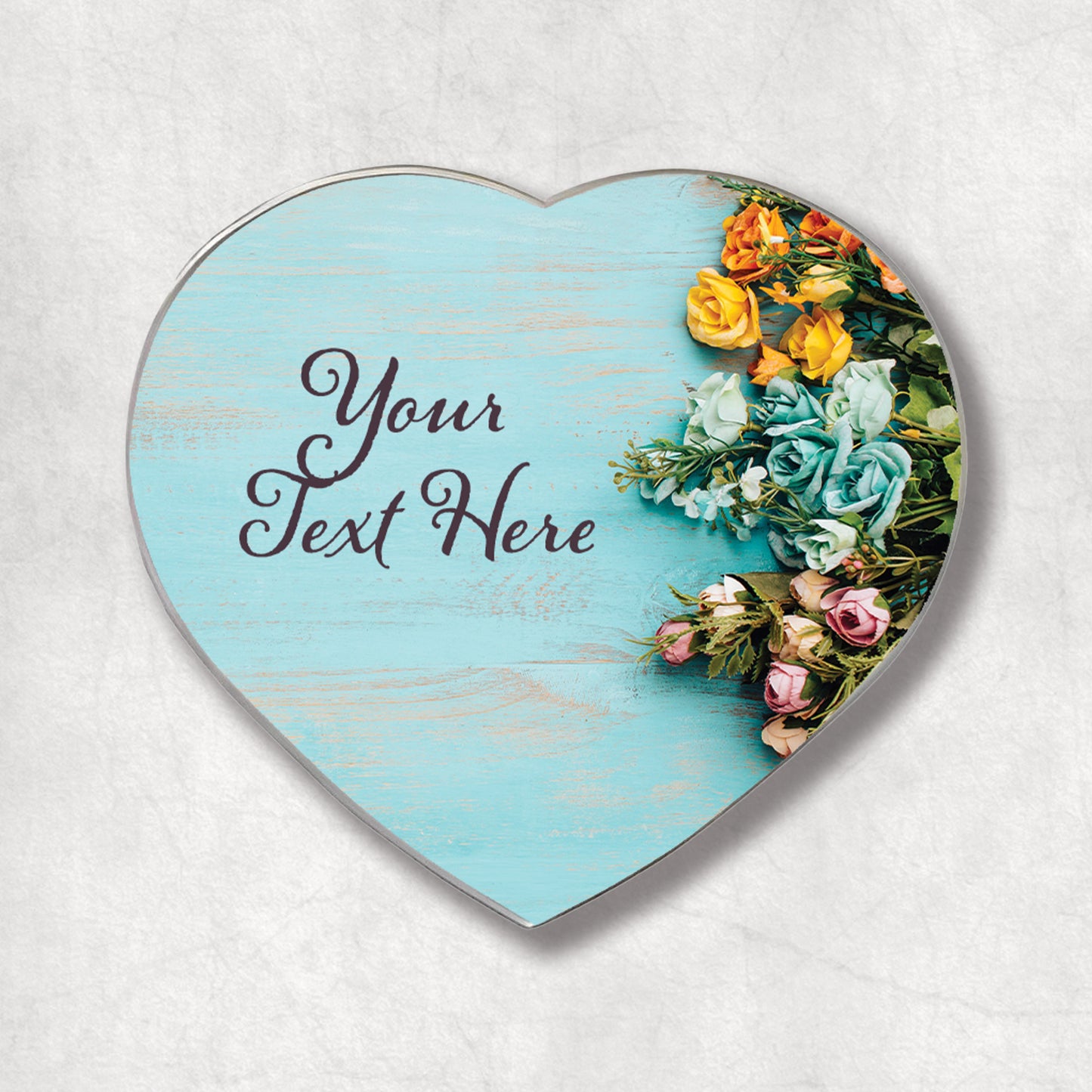 A heart-shaped magnet with a blue, floral background and your text on the left side. The perfect gift for Mother's Day.