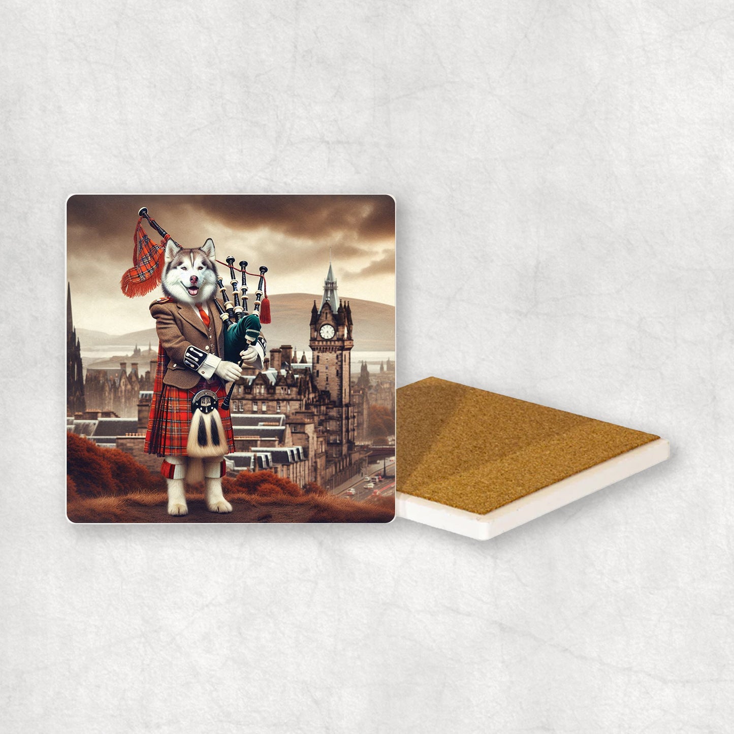 Ceramic Coaster gift with a Husky dog design, dressed in traditional Scottish costume, playing the bagpipes, with Edinburgh in the background.