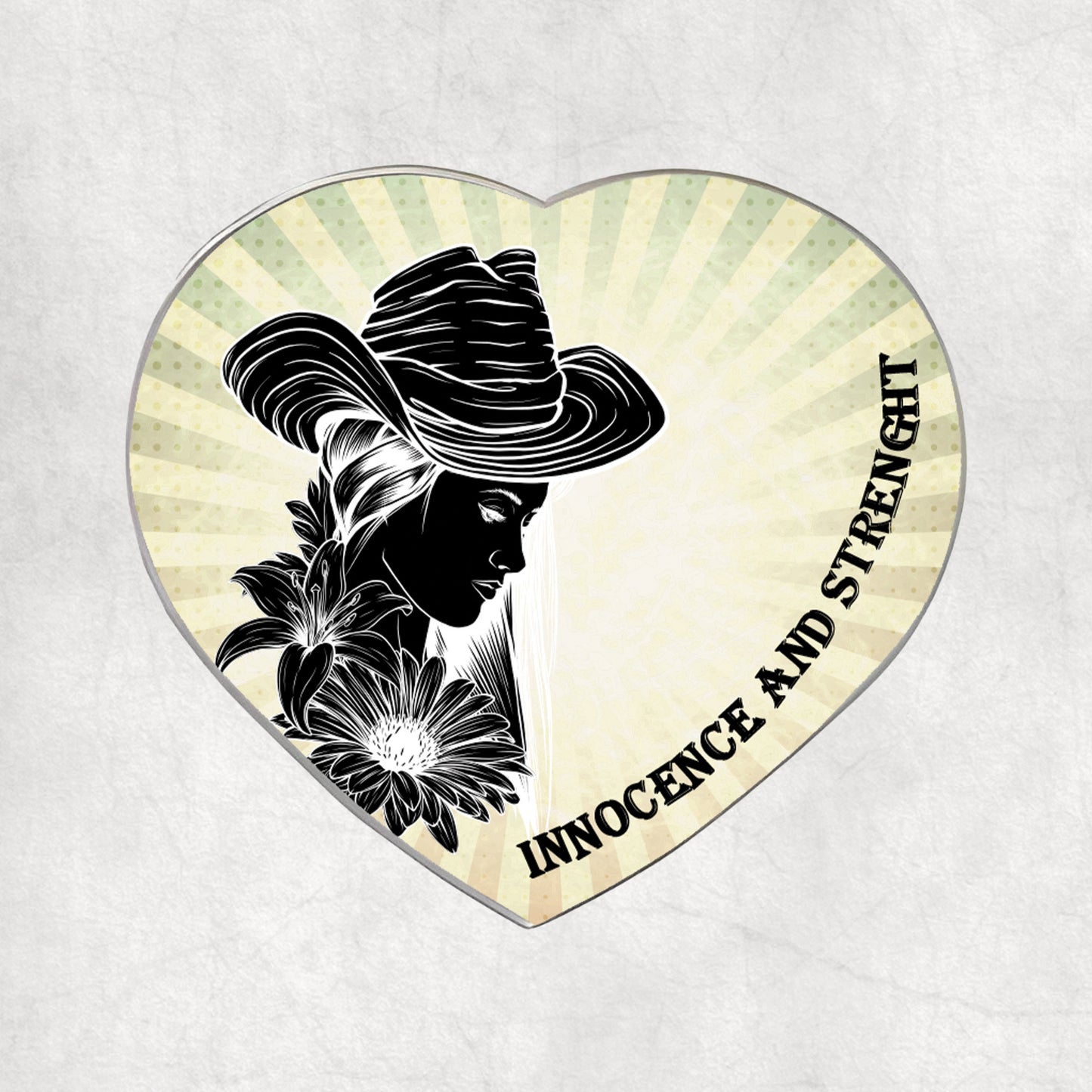 Heart-shaped metal magnet with a silhouette of a woman, flowers, and the text 'Innocence and Strength' on a light vintage background.