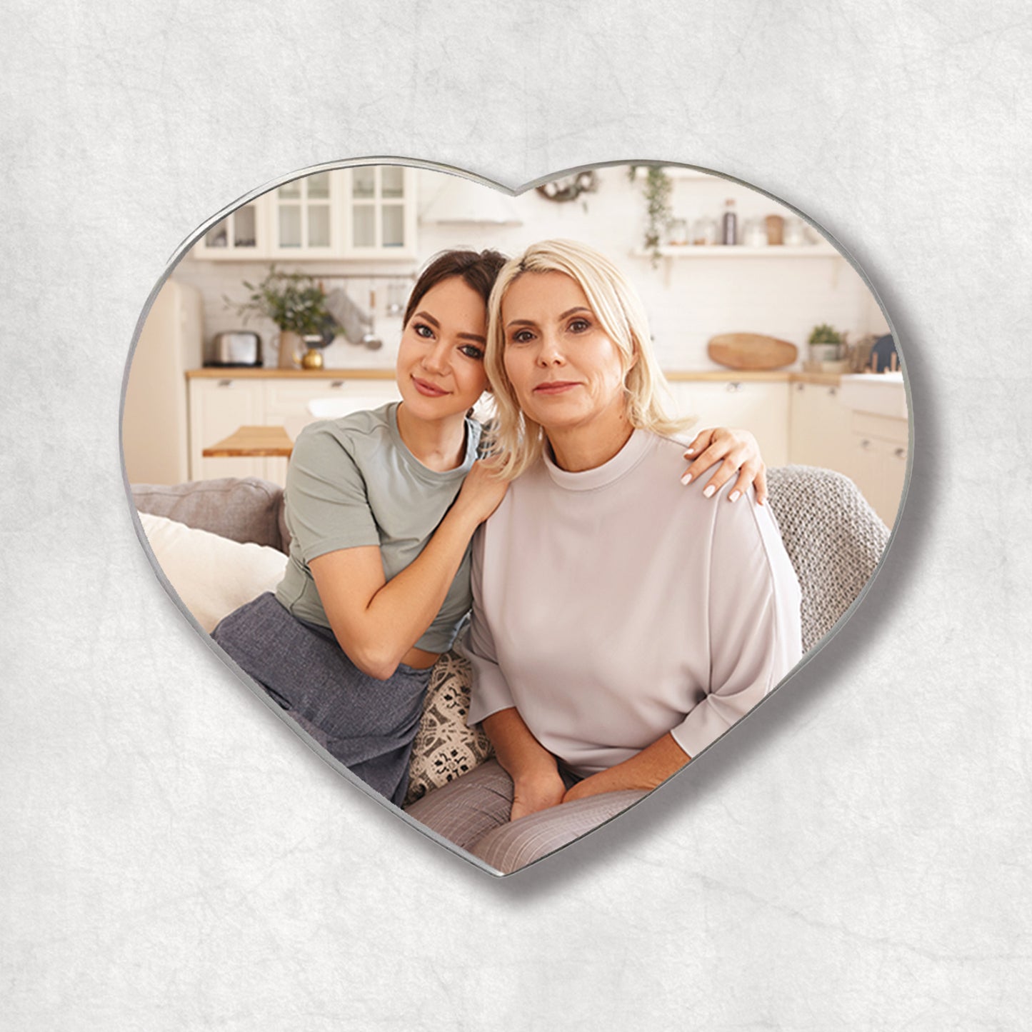 A heart-shaped metal magnet with a personalised photo, the perfect gift for Mother's Day.