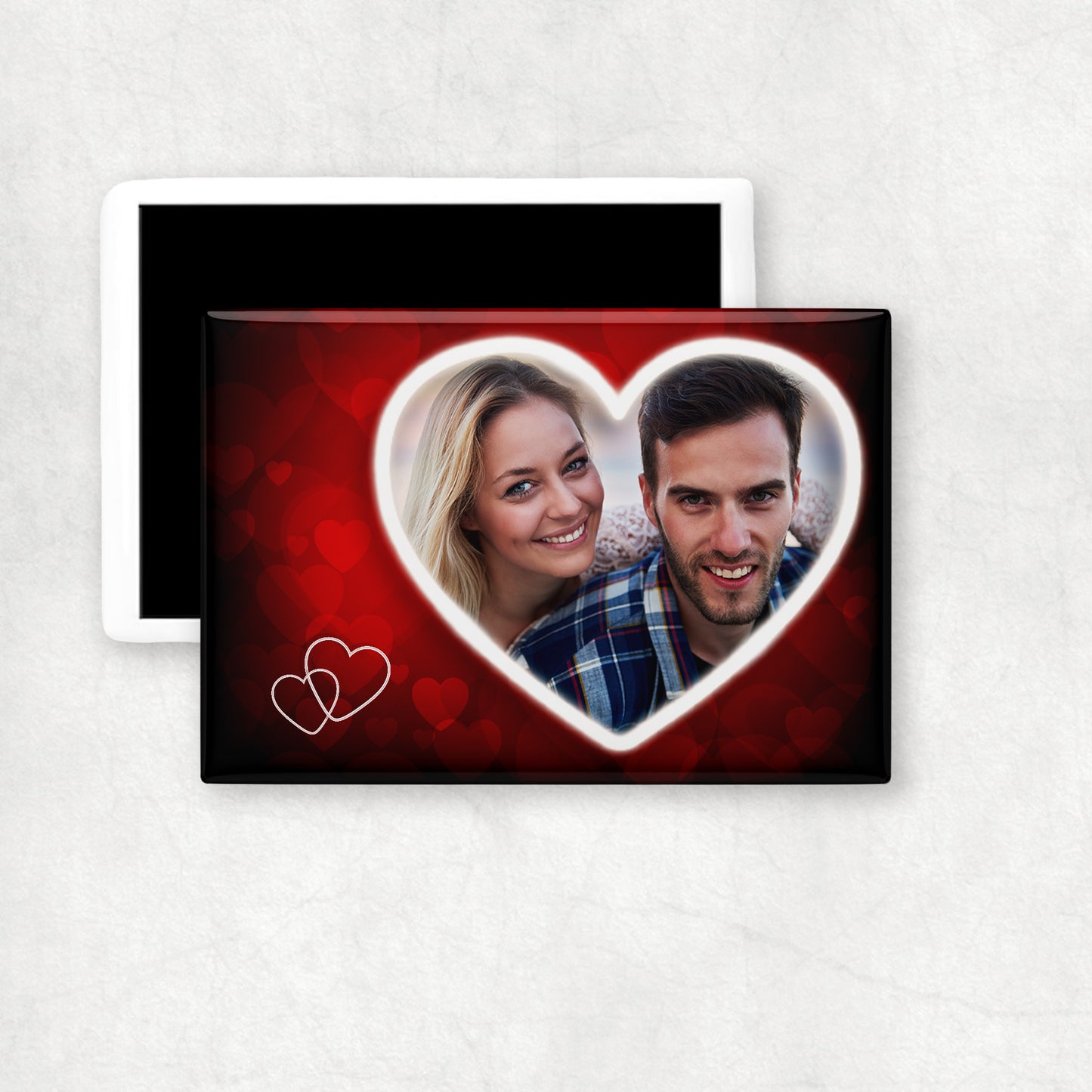 Heart-shaped personalised photo on a red background with two small white hearts in the left bottom corner.