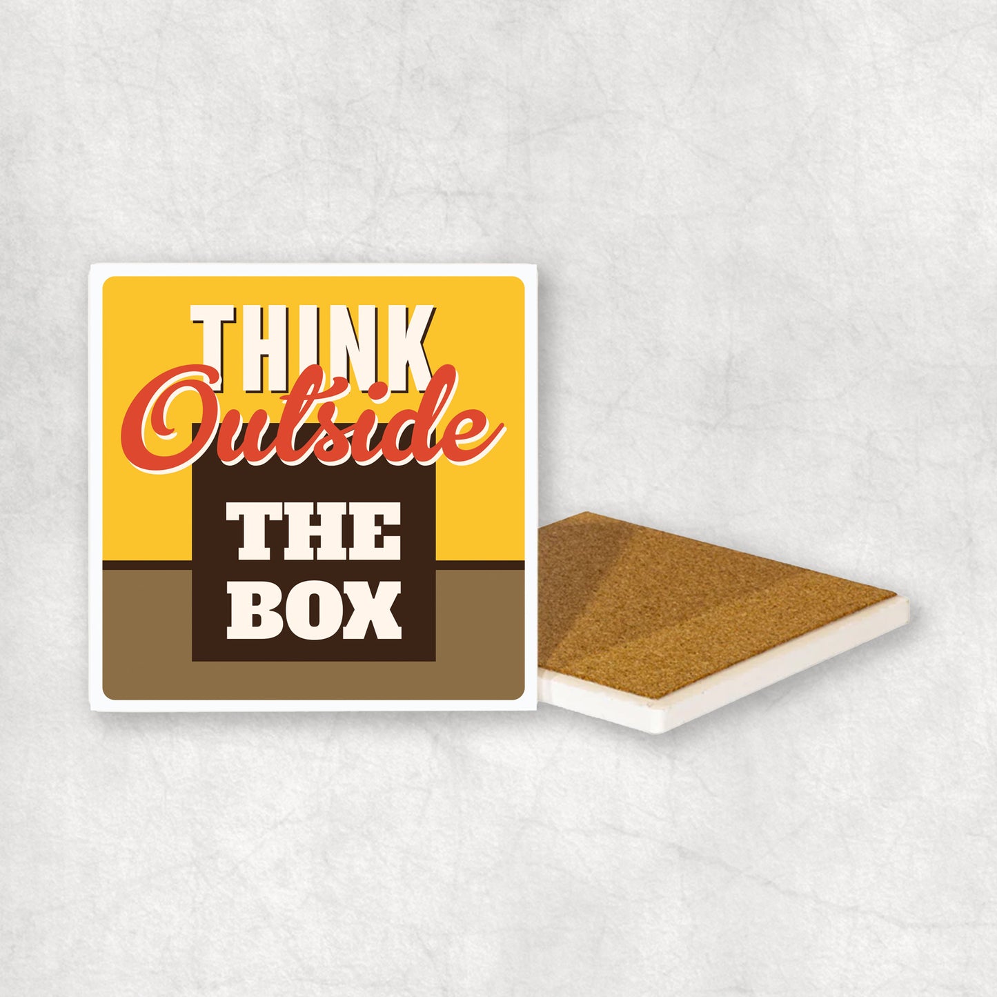 Inspiring ceramic coaster with 'Think outside the box' text, perfect gift for any occasion.