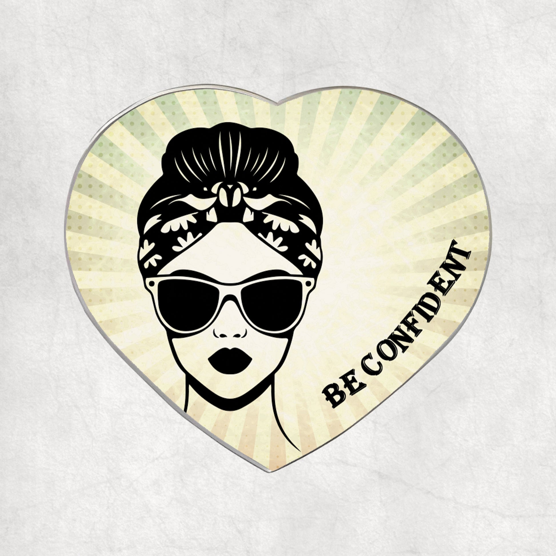 Heart-shaped metal magnet with a woman's face, sunglasses, and 'Be Confident' text on a light vintage background.