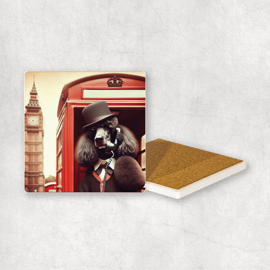 Ceramic coaster gift with a Black Poodle dog design, wearing a suit, talks on the phone in a red telephone booth in London with Big Ben in the background. 