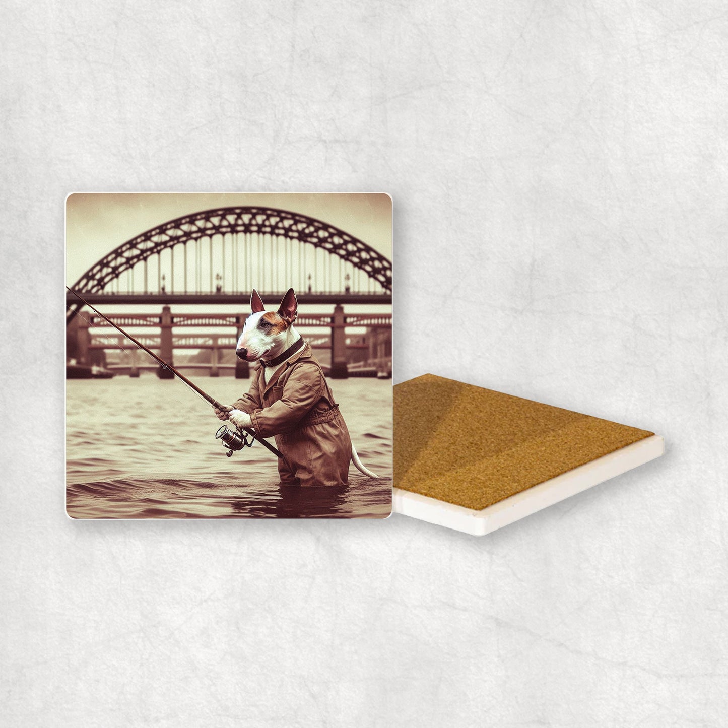 Ceramic Coaster gift with a Bull Terrier dog design, dressed in an Angler costume, fishing in the Tyne river, with Newcastle bridges in the background.