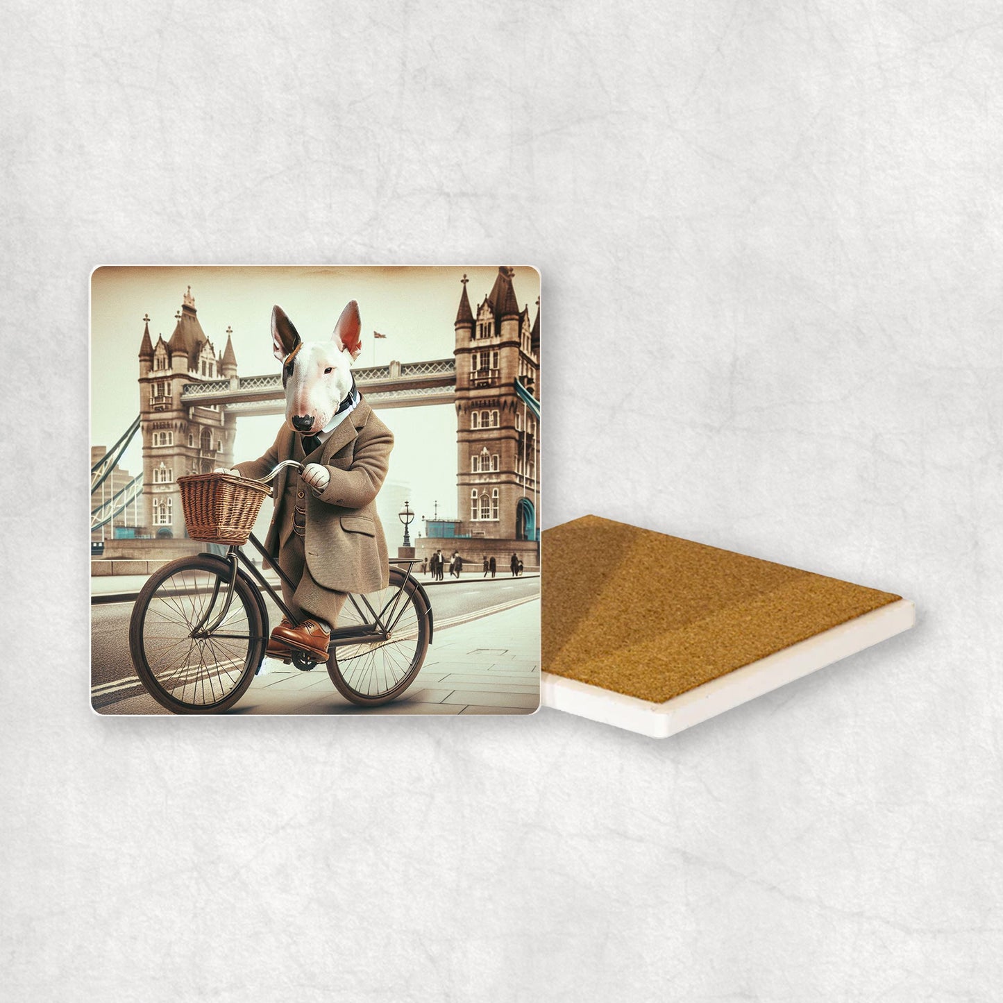 Ceramic coaster gift with a Bull Terrier dog design, dressed in a suit, riding a bike with the Clifton Suspension Bridge in the background.