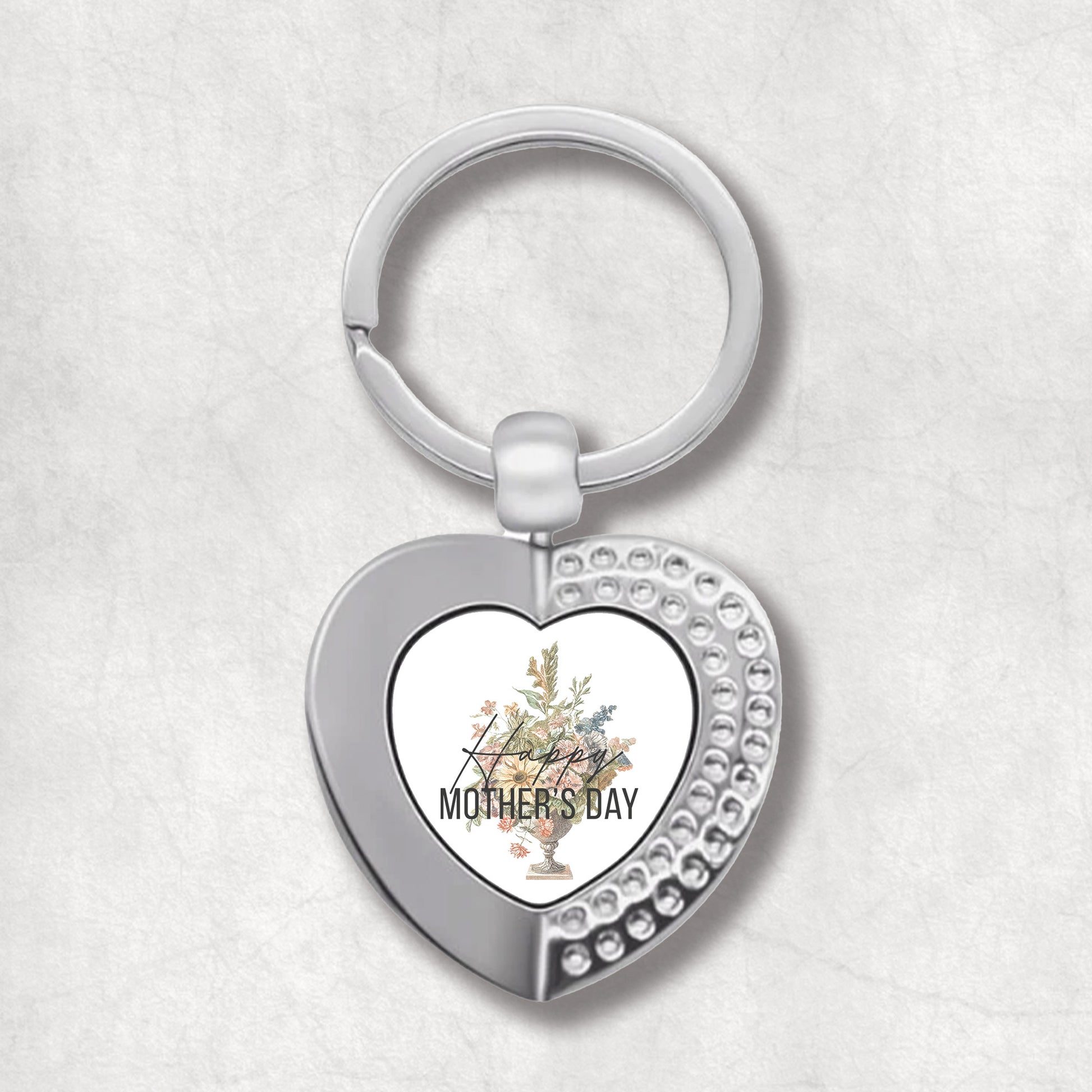 An elegant heart-shaped keyring with a floral design and the text 'Happy MOTHER'S DAY' on it.