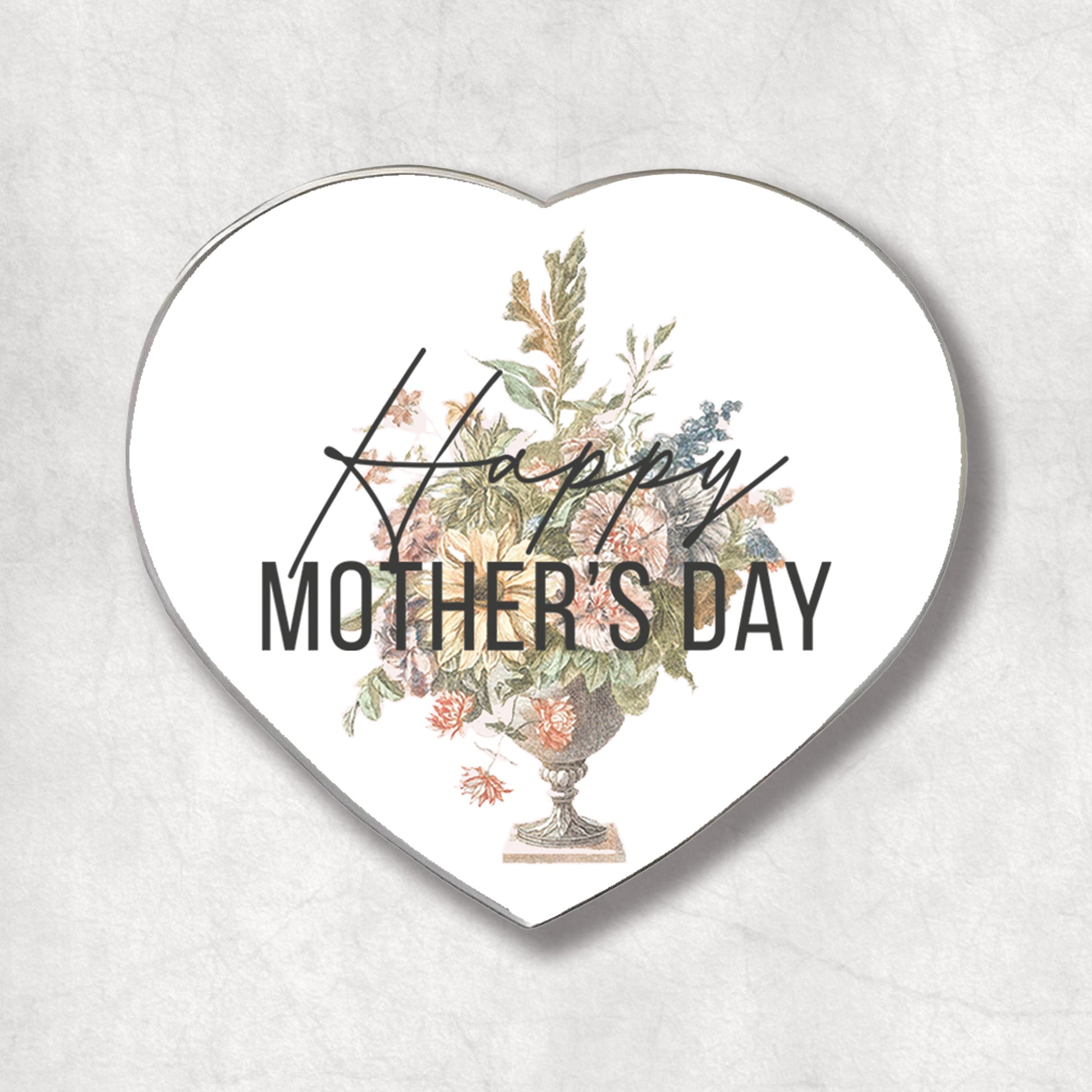 A heart-shaped metal magnet with a floral design and the text 'Happy Mother's Day'.