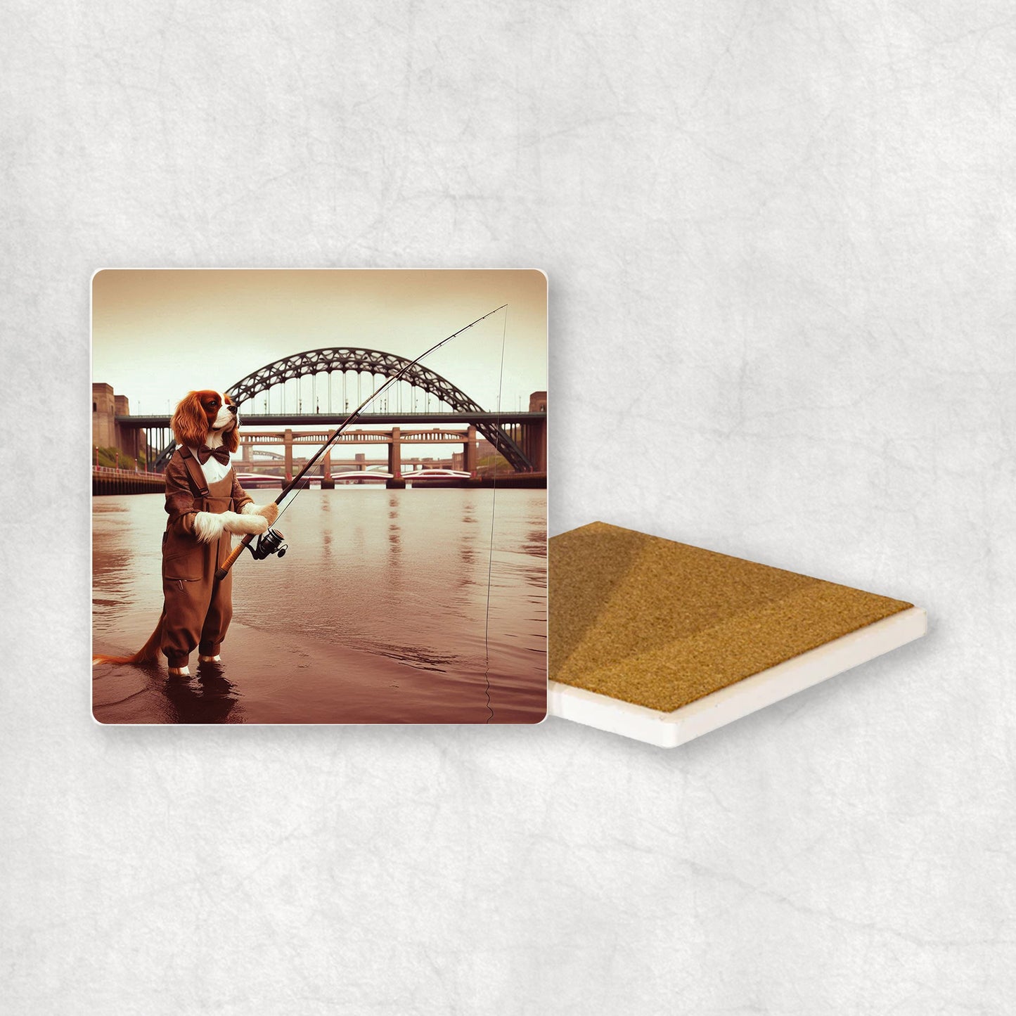 Ceramic Coaster gift with a Cavalier dog design, dressed in an Angler costume, fishing in the Tyne river, with Newcastle bridges in the background.