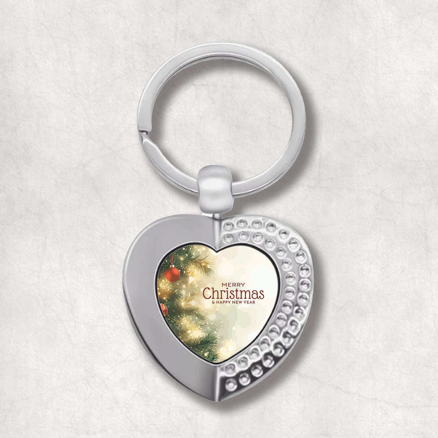 Heart-shaped keyring with Christmas tree design & Christmas wishes.  An elegan gift for Christmas. 