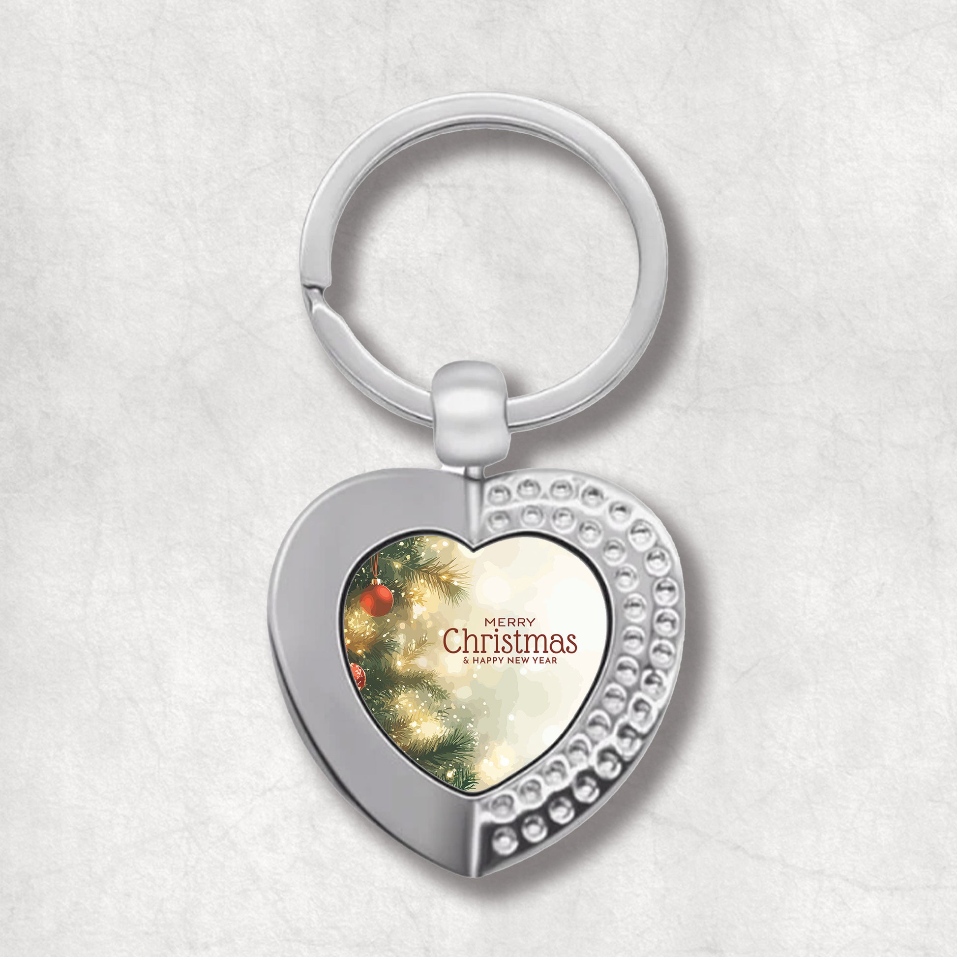 Heart-shaped keyring with Christmas tree design & Christmas wishes.  An elegan gift for Christmas. 