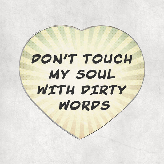 Heart-shaped metal magnet with 'Don't touch my soul with dirty words' text, on a light vintage background.