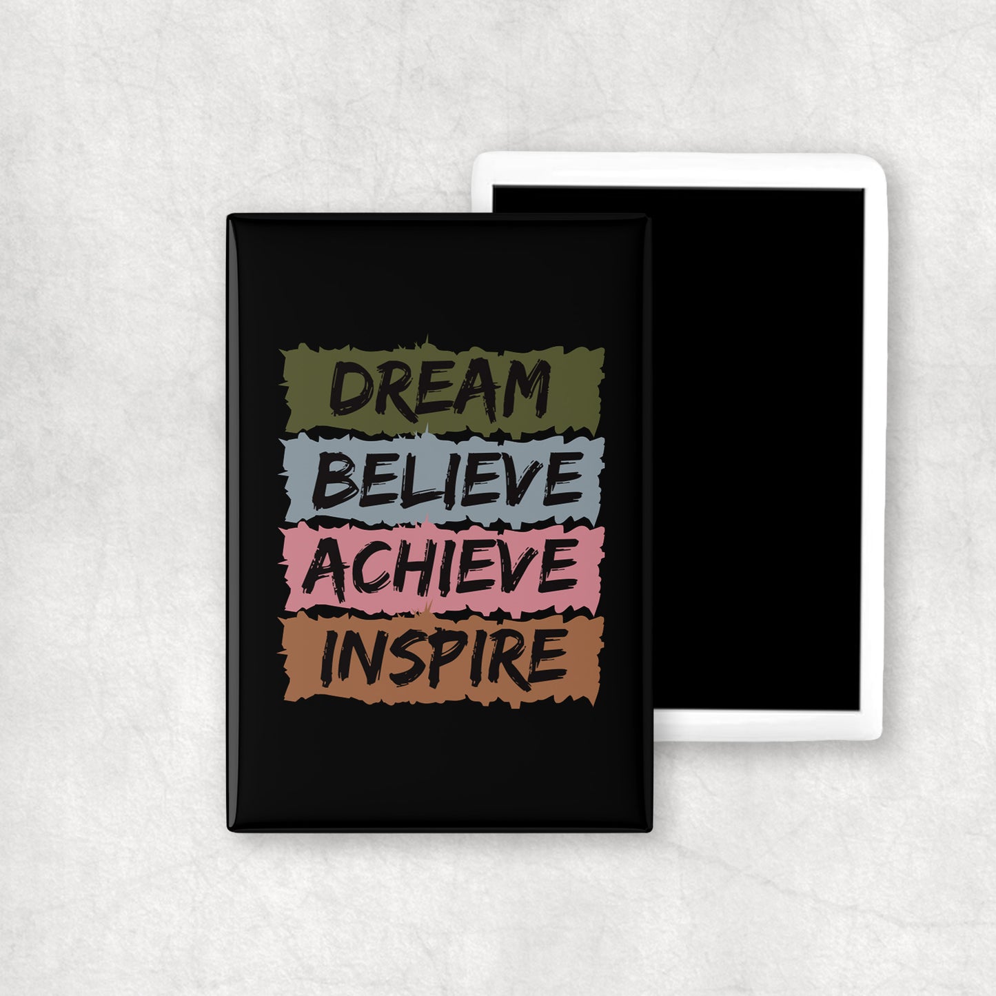 A vertical ceramic magnet with 'DREAM BELIEVE ACHIEVE INSPIRE' text on a black background, a perfect gift for any occasion.