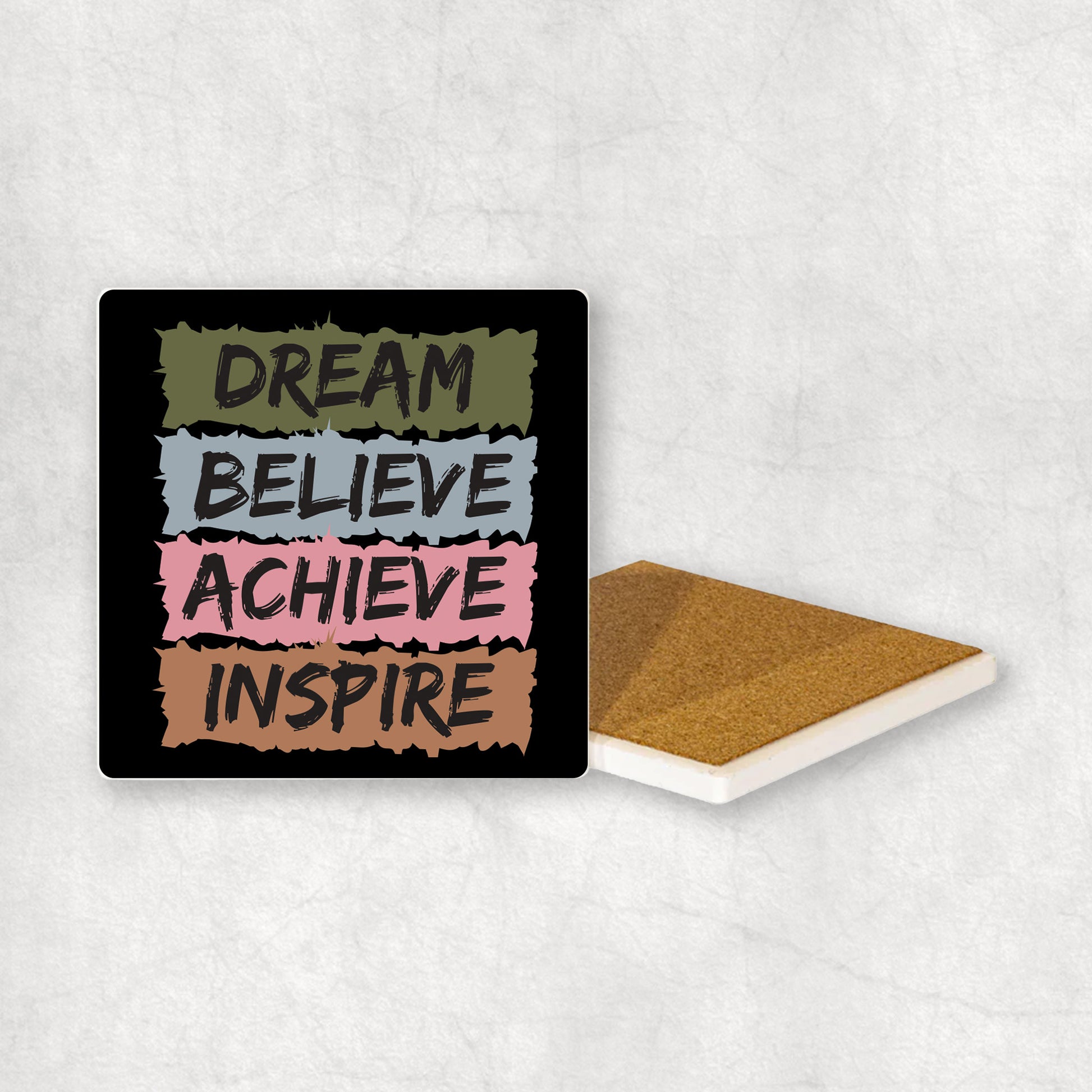 Inspiring ceramic coaster with 'Dream Believe Achieve Inspire' text, perfect gift for any occasion.