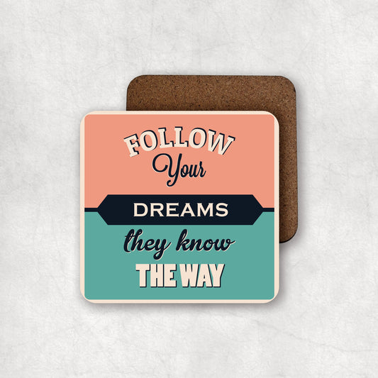 Inspiring MDF coaster with 'Follow your dreams they know the way' text on a vintage background, the perfect gift for any occasion.