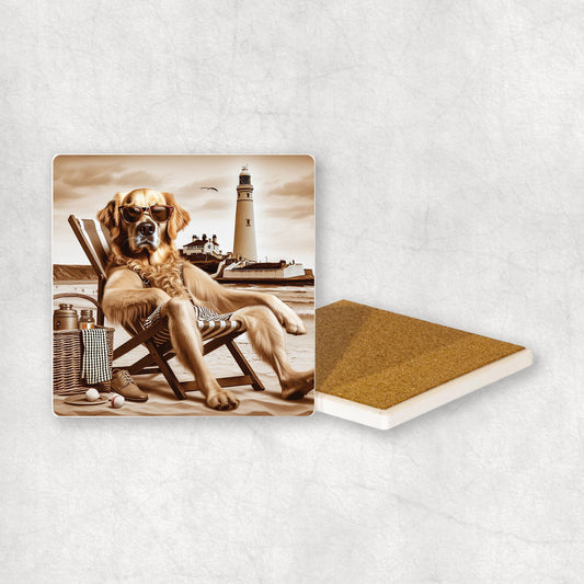Ceramic Coaster gift with a Golden Retriever dog design, wearing shorts, relaxes on a beach lounger at Whitley Bay with a lighthouse in the background.