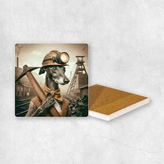Ceramic Coaster gift with a Greyhound dog design, dressed like a miner with a pickaxe in its paw, with a mine in the background.