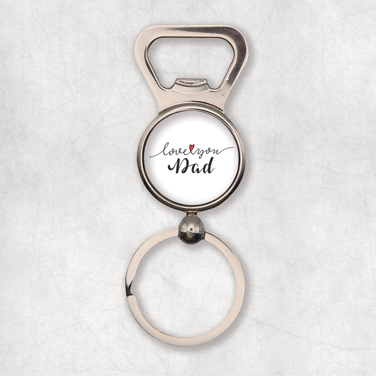 A silver bottle opener keyring with 'Love You Dad' text with heart symbol on a white background.