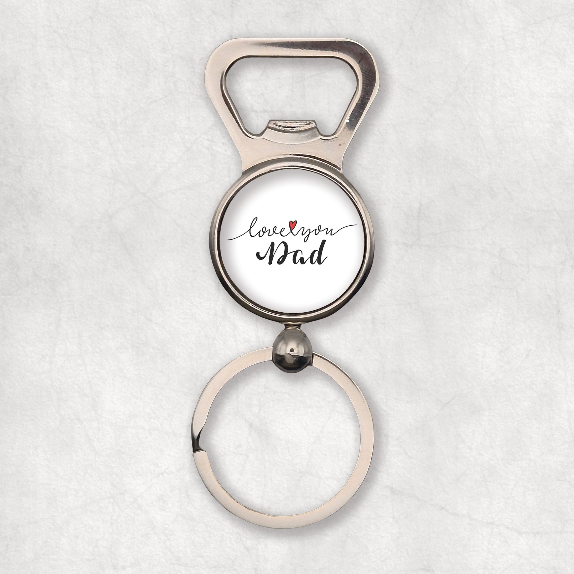 A silver bottle opener keyring with 'Love You Dad' text with heart symbol on a white background.