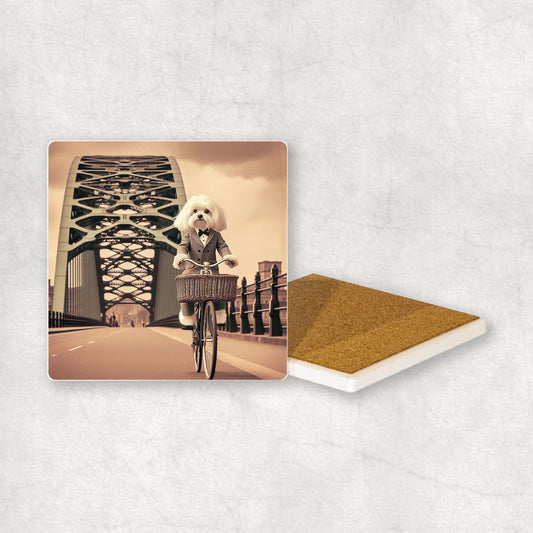 Ceramic coaster gift with a Maltese dog design, dressed in a suit, riding a bike on the bridge.