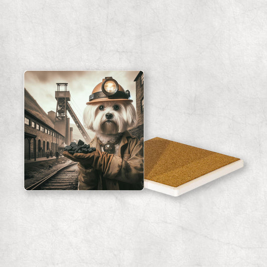 Ceramic Coaster gift with a Maltese dog design, dressed like a miner with a pickaxe in its paws, with a mine in the background.