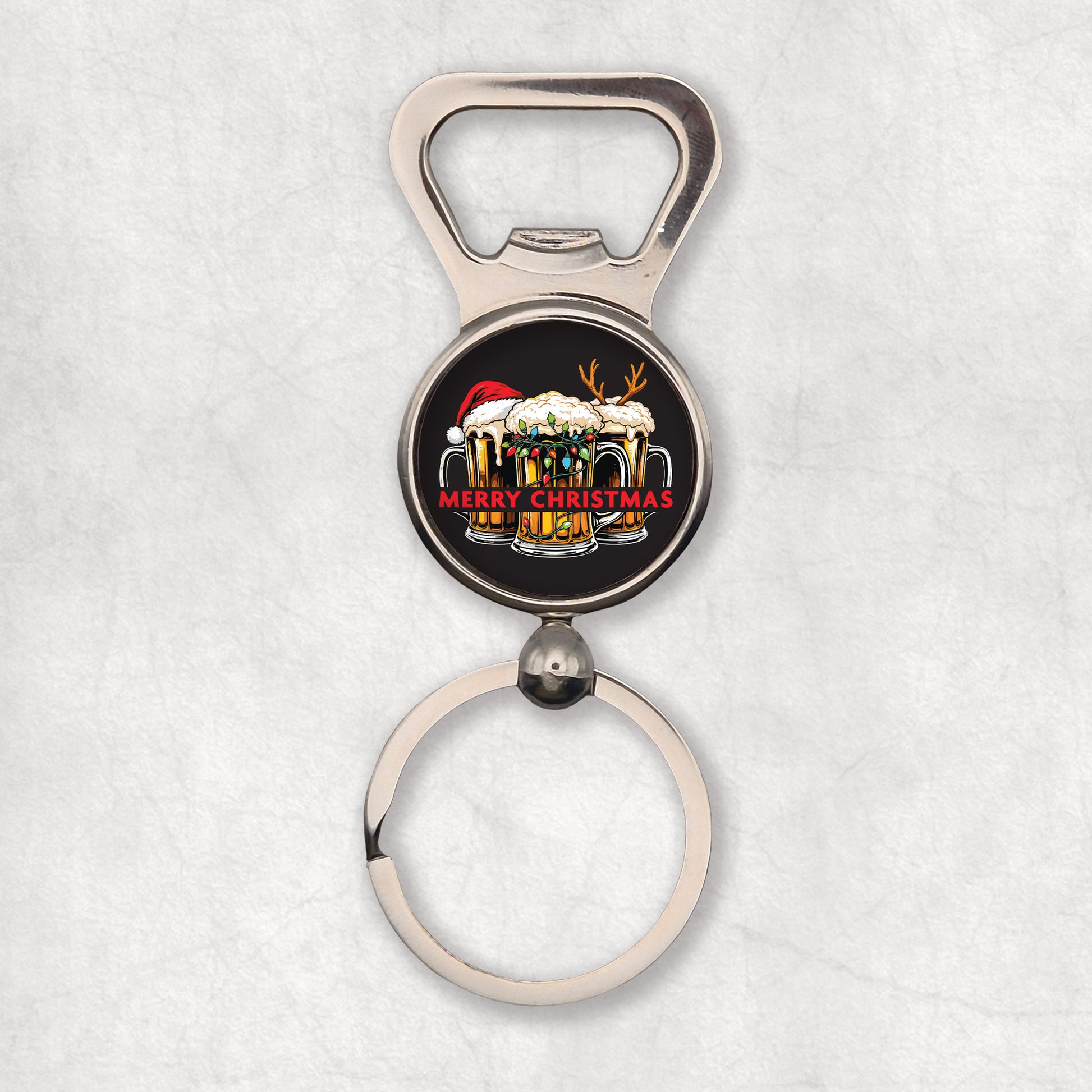 Bottle opener keyring with Christmas design presented tree pints of beer with christmas hat & light on a black background.