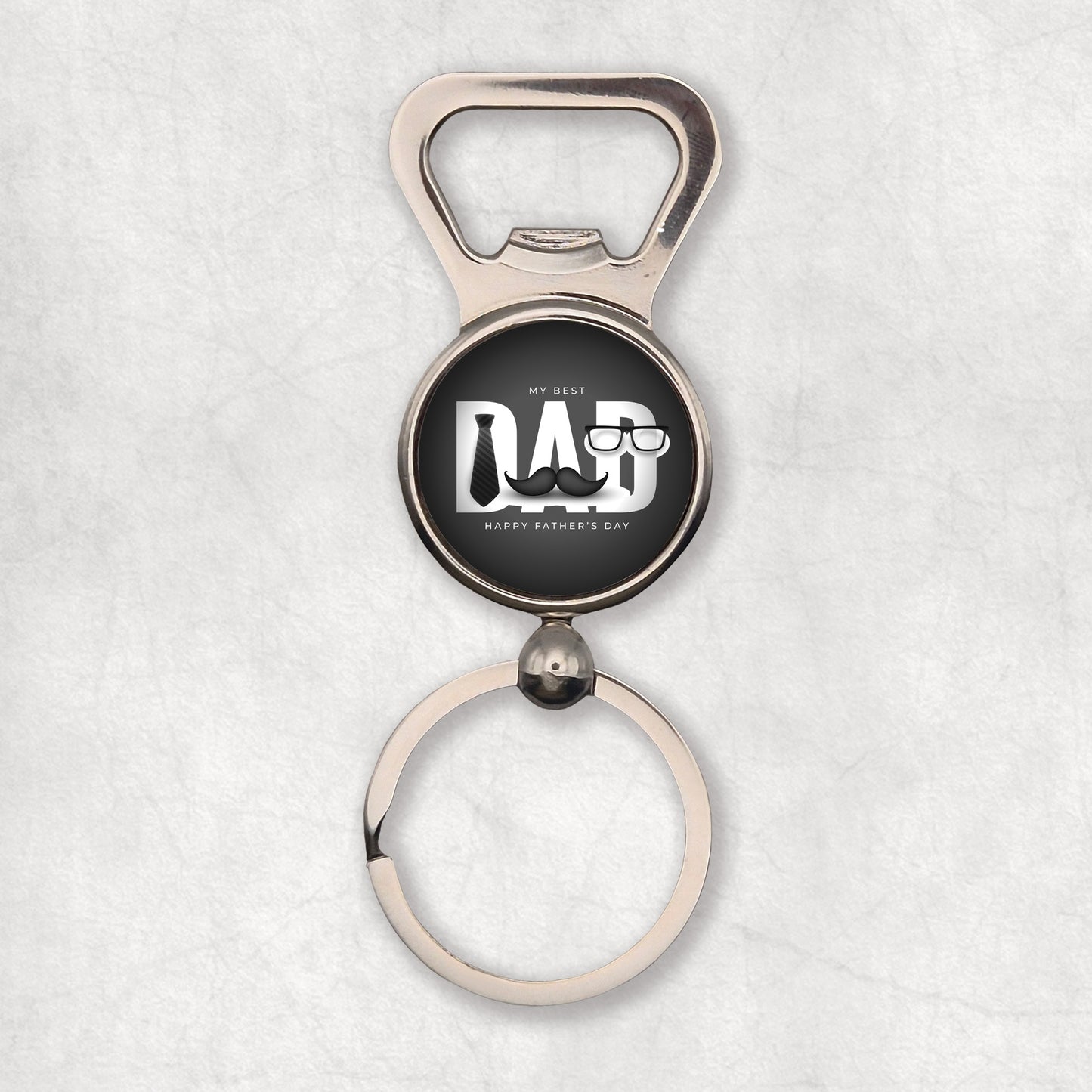 A silver bottle opener keyring with a circular attachment featuring a mustache illustration on a black background and the 'My best Dad' text.