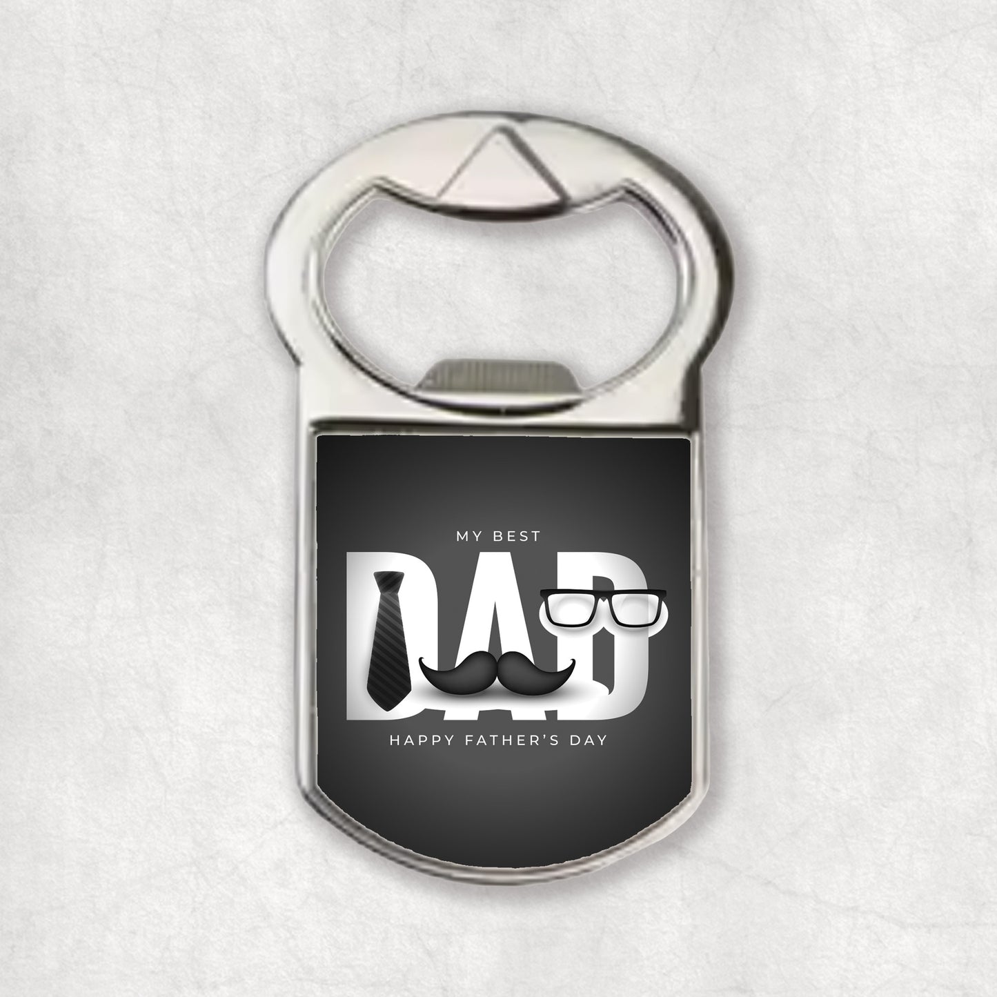 A bottle opener magnet with the 'My Best Dad' text and a graphic of a tie and glasses on a gray background.