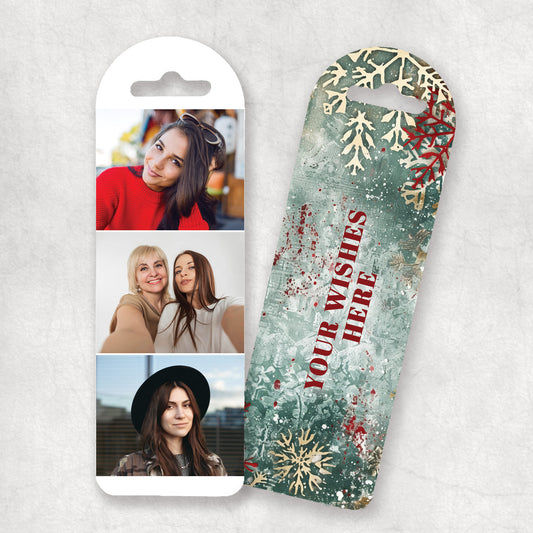 Personalised Christmas bookmark with tree photos on the front and your wishes and decorative, christmas elements, displayed on a gray background on the back.