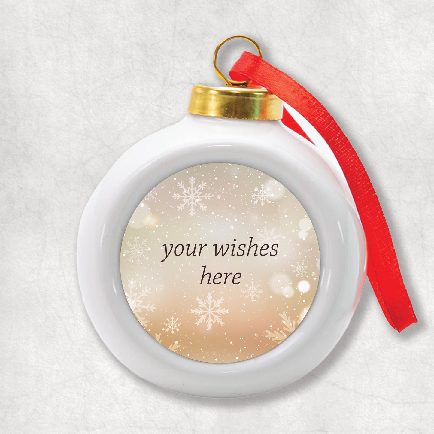 3D Ceramic Christmas bauble with personalised Christmas wishes printed on a festive, snowy background.