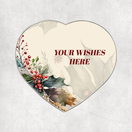 Personalised heart-shaped magnet with custom Christmas wishes printed on a light Christmas, flowery background.