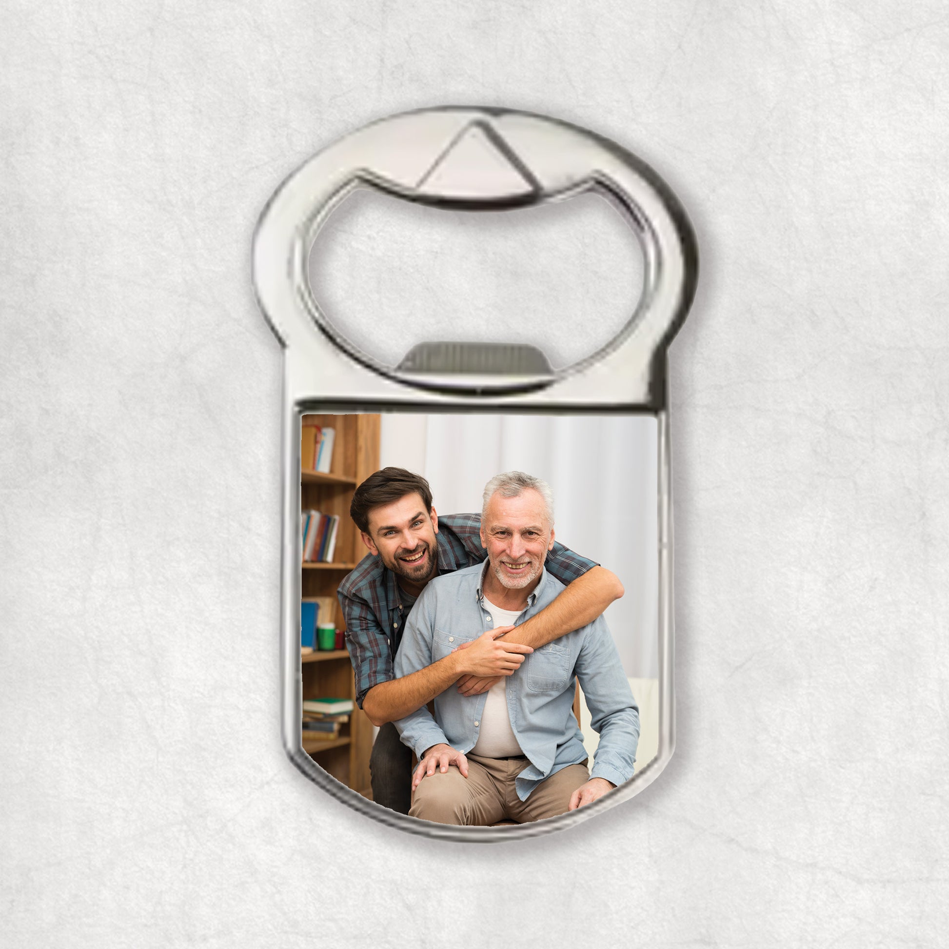 A bottle opener magnet with a personalised photo printed on it.