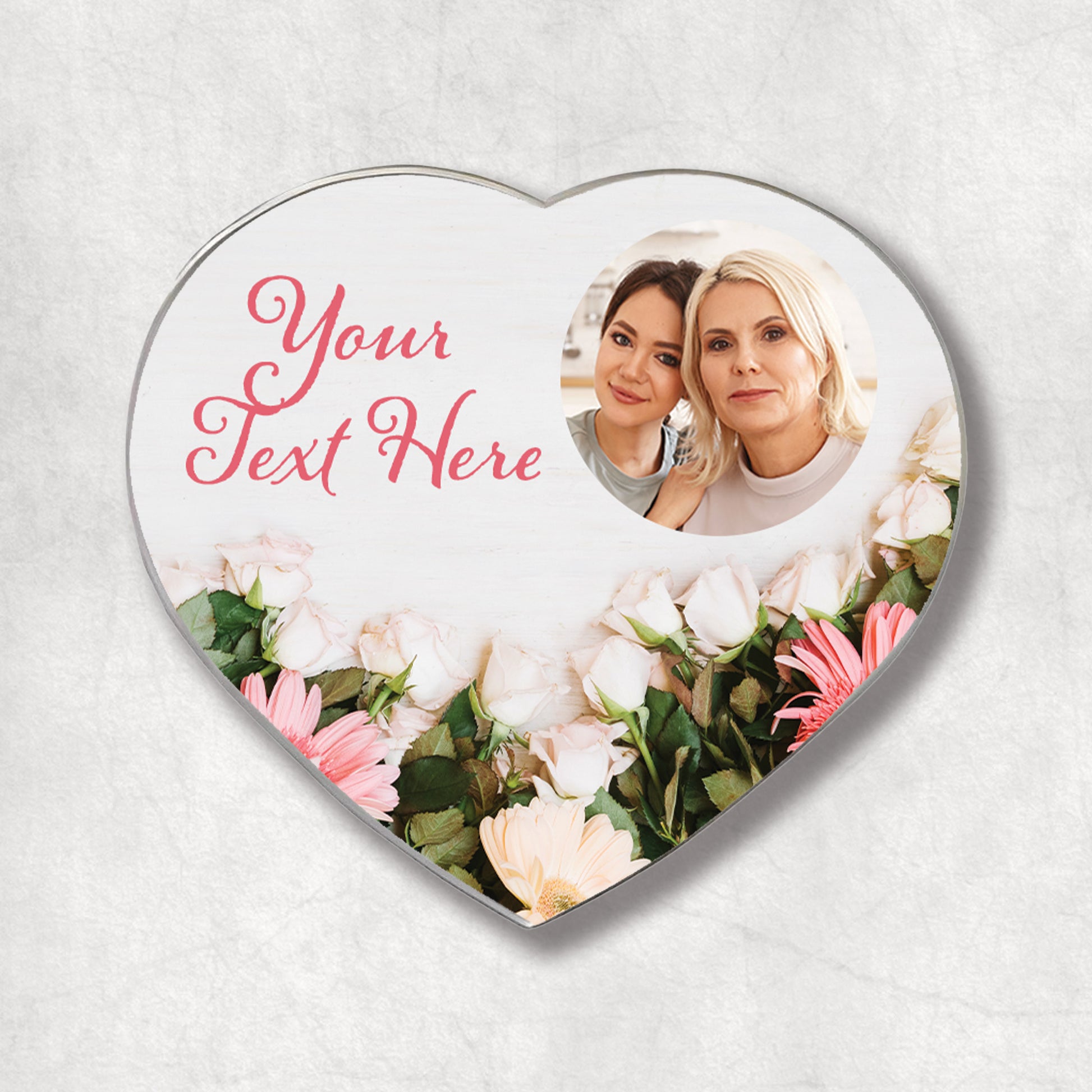 A heart-shaped photo magnet with a floral background and your text, the perfect gift for Mother's Day.