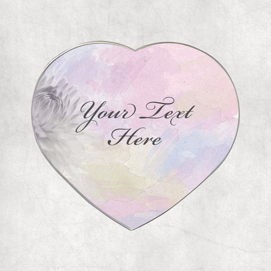 Heart-shaped metal magnet with personalised text design on a light pastel colour background