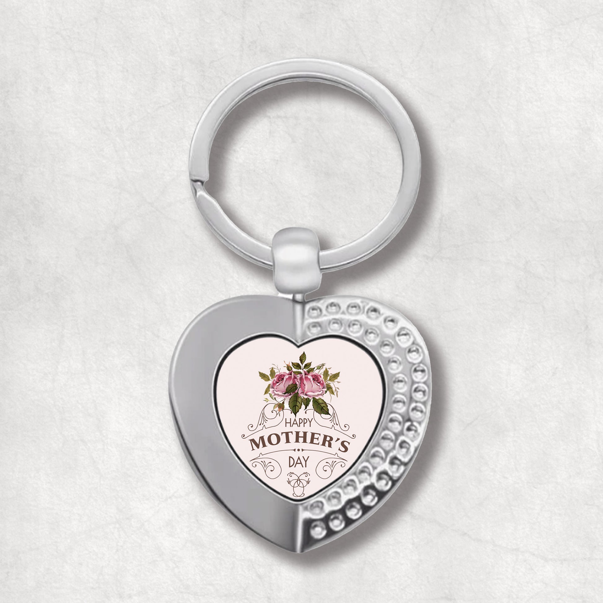 An elegant heart-shaped keyring with a pink rose design and the text 'Happy Mother's Day' on it.