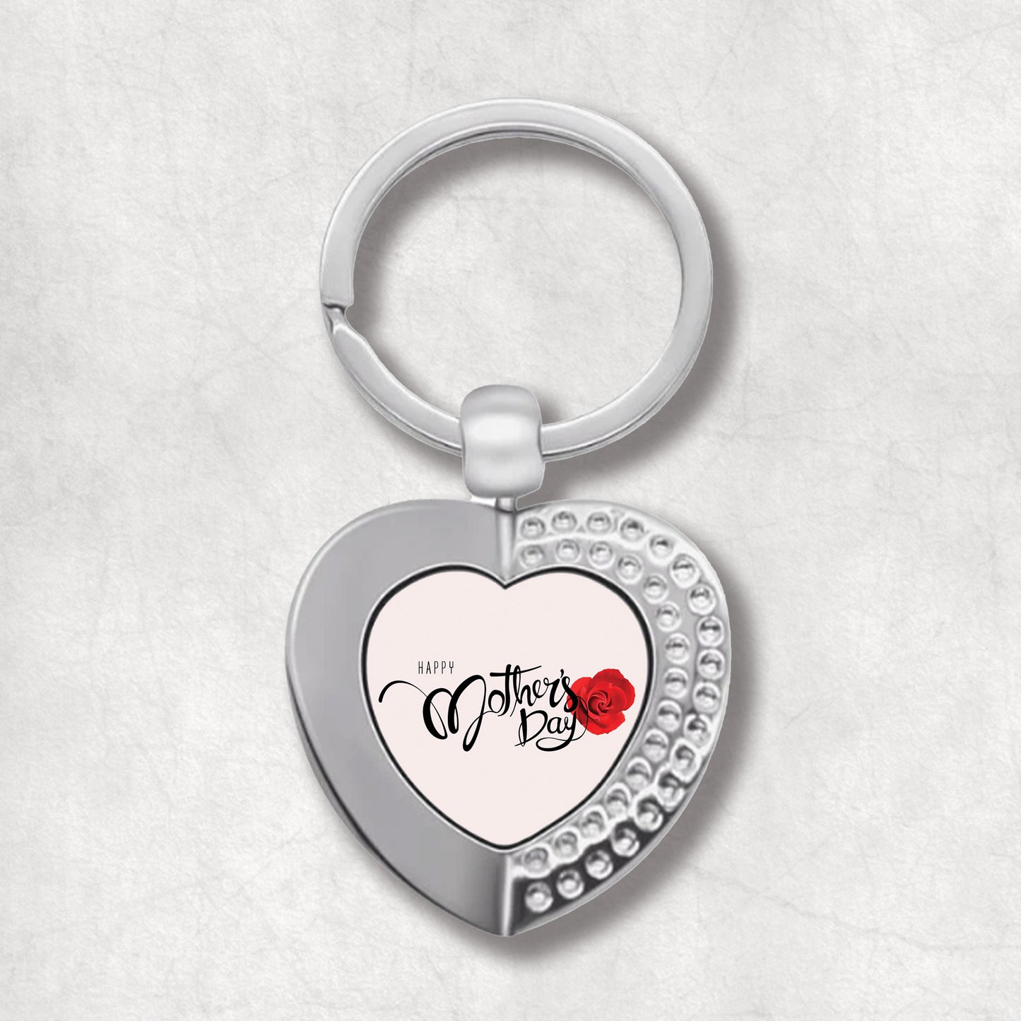 An elegant heart-shaped keyring with a single-sided print that reads 'Happy Mother's Day' and features a red rose on the upper right side. 