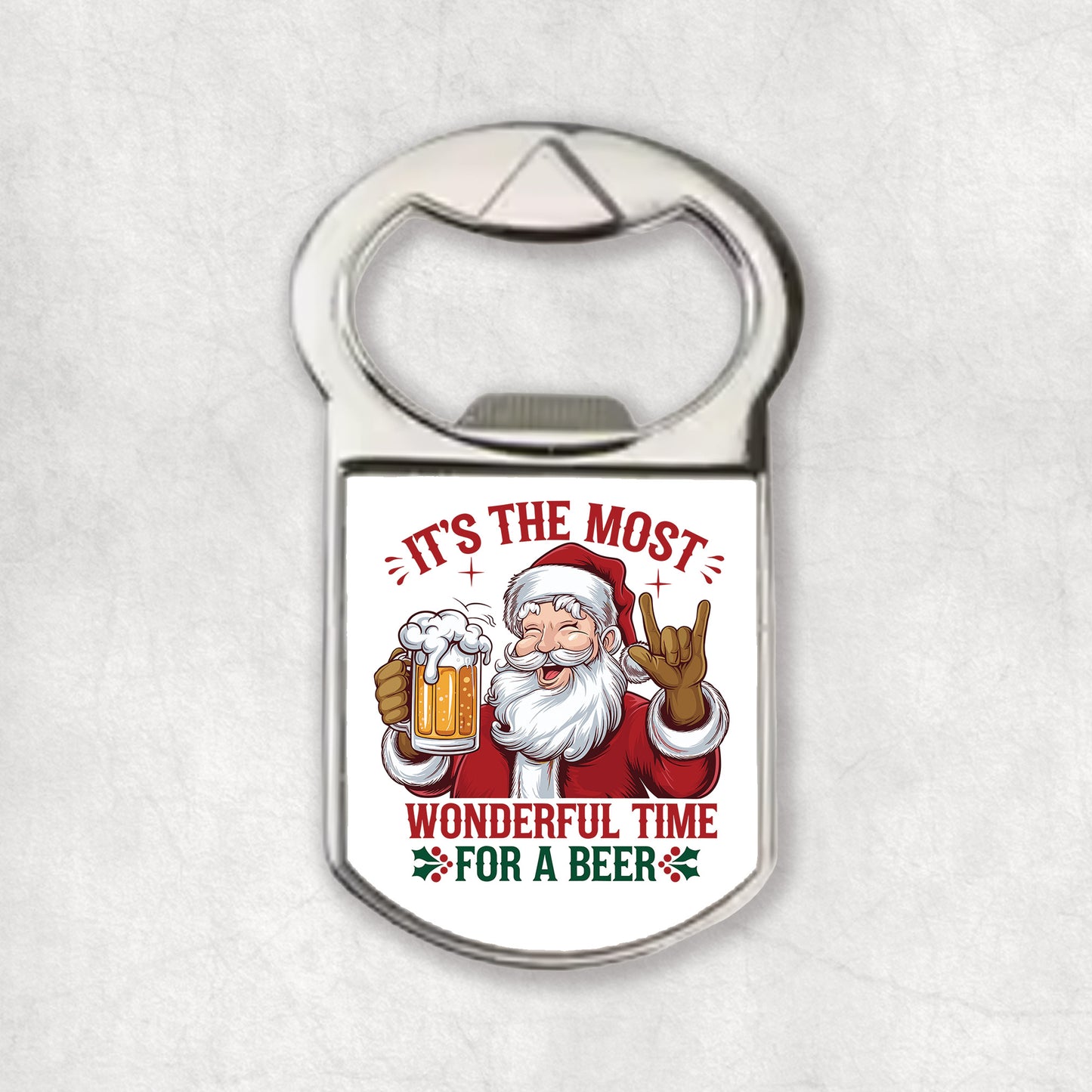 Bottle opener magnet with Santa Claus design and 'It's the most wonderful time for a beer' text on a white background.