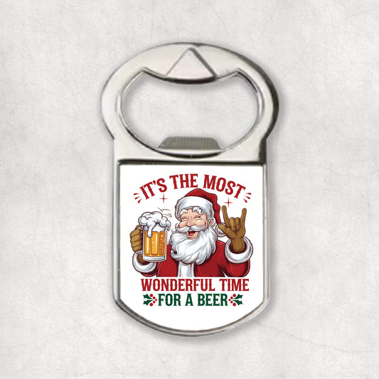 Bottle opener magnet with Santa Claus design and 'It's the most wonderful time for a beer' text on a white background.