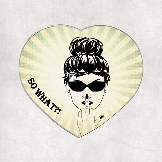 Heart-shaped metal magnet with a stylised face, sunglasses, and 'So What?!' text on a light  vintage background.