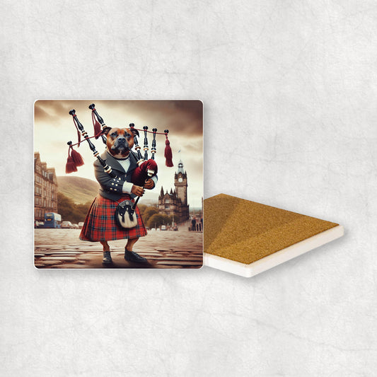 Ceramic Coaster gift with a Staffordshire Bull Terrier dog design, dressed in traditional Scottish costume, playing the bagpipes, with Edinburgh in the background. 