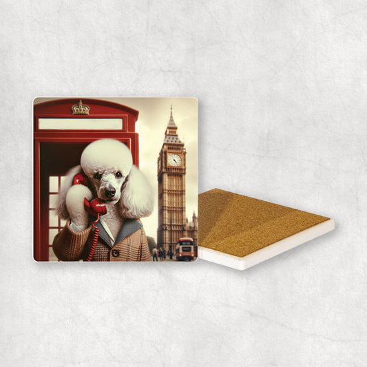 Ceramic coaster gift with a White Poodle dog design, wearing a suit, talks on the phone in a red telephone booth in London with Big Ben in the background. 