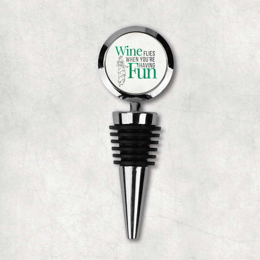 Elegant wine bottle stopper with 'Wine flies when you're having Fun' inspirational phrase on a white background, the perfect gift for wine lovers.