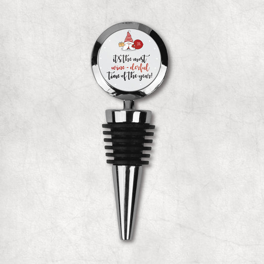 Christmas wine bottle stopper with funny quote 'It's the most wine-derful time of the year' and Christmas gnome. 