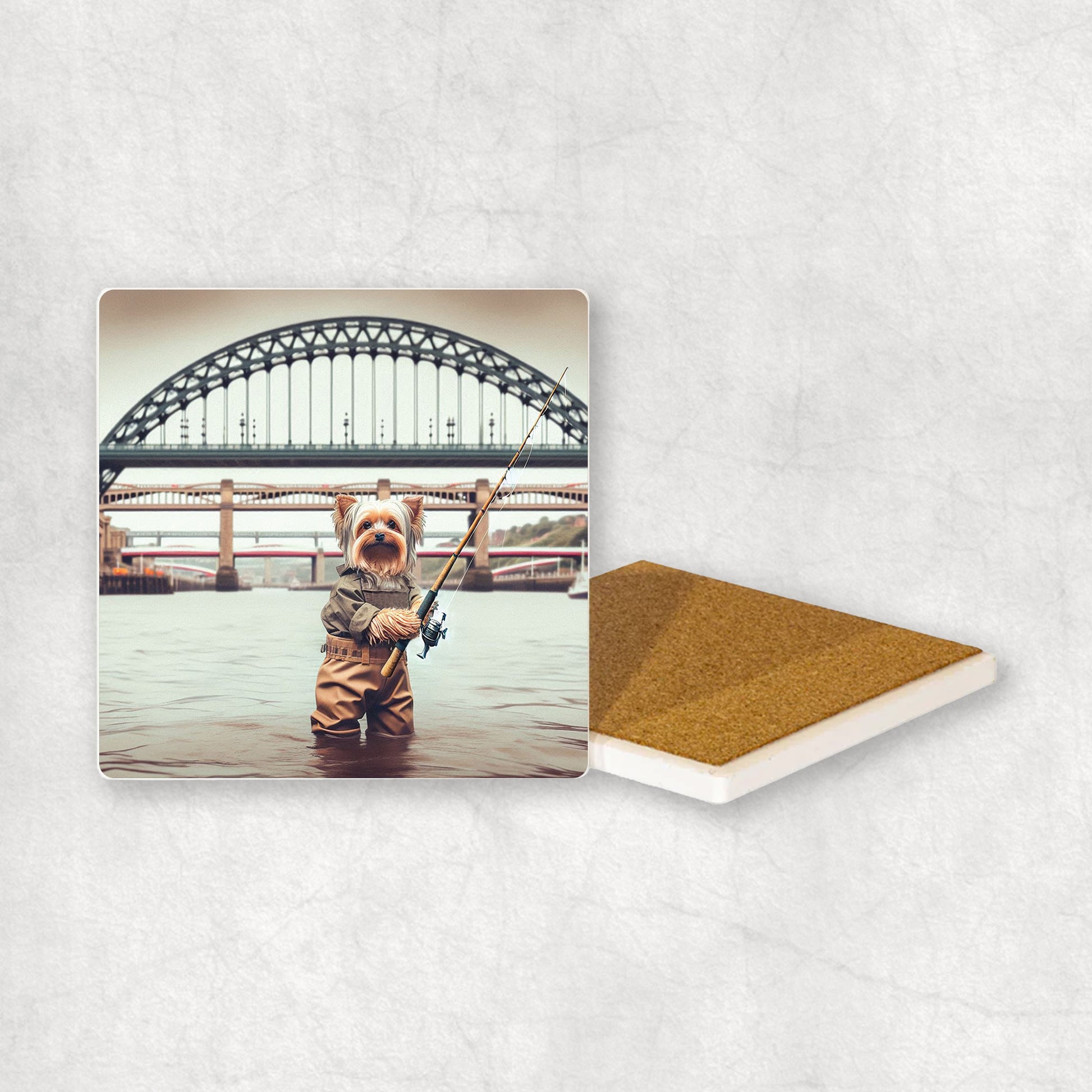 Ceramic Coaster gift with a Yorkshire Terrier dog design, dressed in an Angler costume, fishing in the Tyne river, with Newcastle bridges in the background.