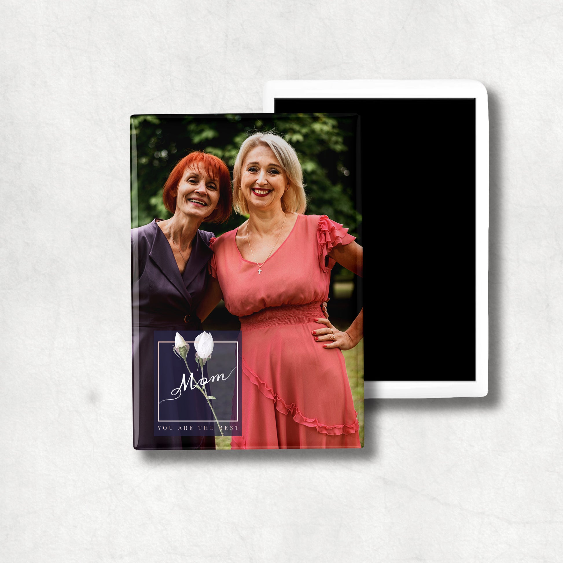 A personalised vertical ceramic magnet with a photo print and text that reads 'Mom You Are The Best'.