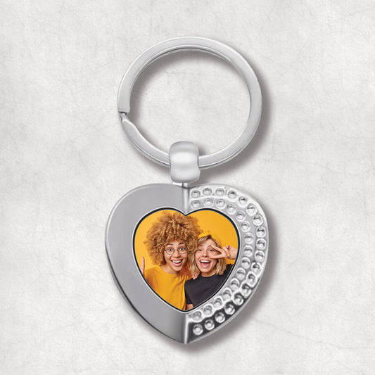 Metal heart-shaped keychain with a personalised photo. 